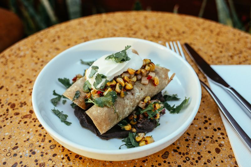 Loaded Beef Nachos with salsa and sour cream