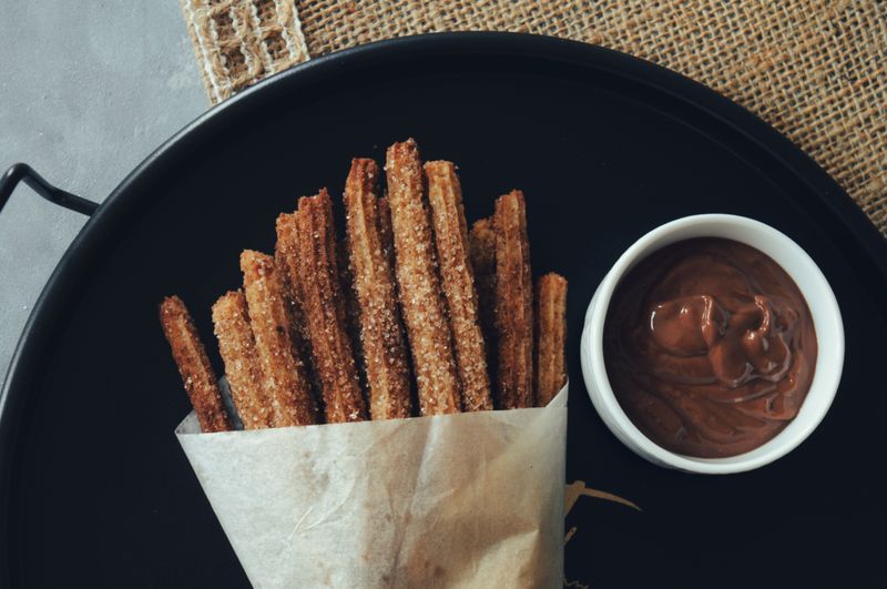 Cinnamon churros with dark chocolate dipping sauce